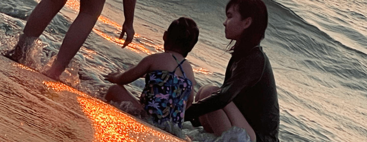 Sandy and family on the beach.